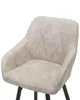 A close-up view of a beige upholstered bar stool. Náhled obrázku produktu