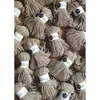 A collection of spools of beige yarn, each with a white label. Produktbild-Vorschau