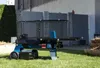 A log splitter is shown on a grassy lawn in front of a modern house. Produktbild-Vorschau