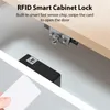 A smart cabinet lock is shown installed inside a cabinet, with a card being presented to unlock it. Náhled obrázku produktu