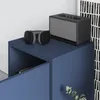 A close-up of a blue cabinet with a pair of headphones and a speaker on top. Anteprima dell’immagine prodotto