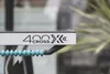 A close-up of a silver table tennis table with the brand name '400X CROSS' visible. A blue beaded cable is attached to the table. Produktbild-Vorschau