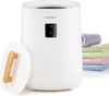 A white towel warmer with a digital display and a stack of colorful towels next to it. The lid is partially open, revealing a wooden handle. Anteprima dell’immagine prodotto