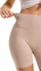Close-up of a person's torso wearing beige ribbed biker shorts. Produktbild-Vorschau