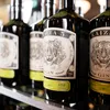 Several bottles of KAIZA 5 GIN are lined up on a shelf. Produktbild-Vorschau