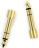 Two gold-colored audio adapters on a white background. Produktbild-Vorschau