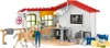 A toy veterinary clinic playset with various animal figures and accessories. Podgląd zdjęcia produktu