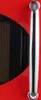 A close-up of a red appliance with a silver handle. Podgląd zdjęcia produktu