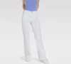 A person is modeling white pants against a light gray background. Produktbild-Vorschau