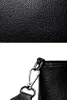 A close-up shot of the texture of a black leather bag and its metal clasp. Náhľad obrázku produktu