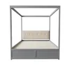 A four-poster bed frame with a tufted headboard and two drawers. Produktbild-Vorschau