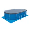 An oval above-ground swimming pool with a cover, placed on a blue ground mat, against a white background. Náhled obrázku produktu