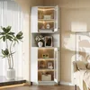 A white corner cabinet with glass doors and interior lighting, displaying various decorative items and bottles. Produktbild-Vorschau