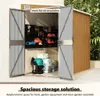 An open shed with tools and garden equipment stored inside. Anteprima dell’immagine prodotto