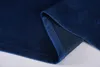 A close-up view of a folded dark blue velvet fabric, showing the texture and hem. Produktbild-Vorschau