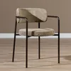 A single chair is shown in a room with a brown wall and wooden floor. Produktbild-Vorschau
