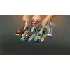 Children's hands interacting with a LEGO Friends racing set, with go-karts lined up at a starting gate. Podgląd zdjęcia produktu