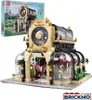 A LEGO-like building set of a botanical garden with a clock tower, shown next to its packaging box. Anteprima dell’immagine prodotto