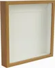 A square shadow box frame with a wooden border and a white matting. Produktbild-Vorschau
