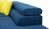 A close-up view of a blue sectional sofa with two yellow throw pillows. Náhľad obrázku produktu