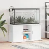 A white aquarium stand with an aquarium on top, placed in a room. Náhľad obrázku produktu