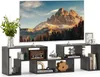 A TV stand with a television and decorative items. Náhled obrázku produktu