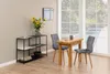 A dining set with a table and two chairs, placed next to a shelf unit with decorative items, in a room with large windows. Podgląd zdjęcia produktu
