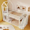 A white wooden bunk bed with a house-shaped frame, complete with bedding and stairs with storage drawers. The room is decorated with children's artwork. Voir les images du produit