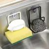 Two sink caddies with cleaning supplies attached to a stainless steel sink. Produktbild-Vorschau