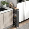 A narrow rolling cart filled with bottles and jars is placed between a kitchen counter and a refrigerator. Náhľad obrázku produktu