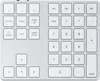 A close-up, top-down view of a silver and white extended keypad. Voir les images du produit