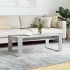 A modern living room scene with a couch, coffee table, and plant. Podgląd zdjęcia produktu