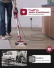 A person is using a red cordless vacuum cleaner in a living room, with a comparison graphic showing a different vacuum with low battery. Produktbild-Vorschau