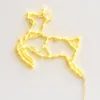 A yellow illuminated reindeer silhouette decoration. Produktbild-Vorschau