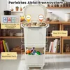 A beige kitchen trash can with multiple compartments, shown in a kitchen setting with shelves and jars in the background. Anteprima dell’immagine prodotto