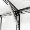 A close-up view of the internal structure of a greenhouse, showing an aluminum frame and clear polycarbonate panels. Produktbild-Vorschau