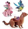Three whimsical wooden toy figures of a fairy riding a pink rabbit, a fairy riding a blue bird, and a fairy sleeping in a wooden carriage pulled by a brown weasel, all on a white background. Produktbild-Vorschau
