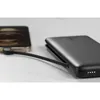 A smartphone is being charged by a power bank. Produktbild-Vorschau