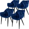 A set of four dark blue velvet dining chairs with black legs, displayed against a white background. Náhľad obrázku produktu