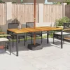 An outdoor patio scene with a wooden table and chairs set up under an umbrella. Produktbild-Vorschau