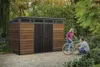 A couple is working on a bicycle in front of a wooden shed in a garden. Náhľad obrázku produktu