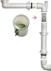 An exploded view of a plumbing trap with a green ball inside a clear container. Produktbild-Vorschau