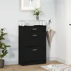 A black shoe cabinet with a glass top and three drawers is shown in a room, next to a plant and an umbrella hanging on a hook. Anteprima dell’immagine prodotto