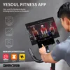 A person is shown interacting with a fitness bike screen that displays an app interface. Náhľad obrázku produktu