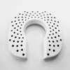 A white humidifier filter with many small holes, shaped like a horseshoe, on a white background. Anteprima dell’immagine prodotto