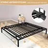 A black metal bed frame is shown in a room with wooden flooring and a light gray wall. There are numbered callouts pointing to different parts of the frame, and a close-up inset shows a detail of the assembly. Produktbild-Vorschau
