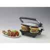 A contact grill with two burgers and a plate of skewers and tomatoes. Produktbild-Vorschau