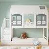 A white bunk bed shaped like a house with gray window frames and a yellow unicorn pillow on the top bunk. Produktbild-Vorschau