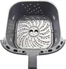 A top-down view of the interior of an air fryer basket. Produktbild-Vorschau