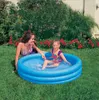 A woman and a child are playing in an inflatable pool in a backyard. Náhled obrázku produktu